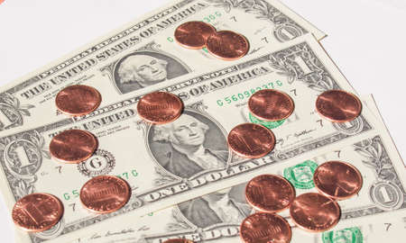 One cent coins and One Dollar banknotes  currency of the United States useful as a backgroundの写真素材