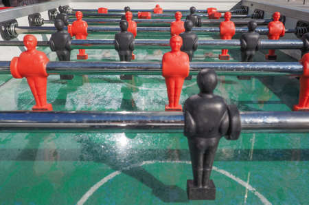 Table football aka table soccer, foosball from the German Tischfussball, baby-foot or kicker table-top game and sportの写真素材