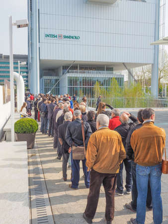 TURIN, ITALY - APRIL 11, 2015: People queueing to visit the new Intesa San Paolo skyscraper designed...