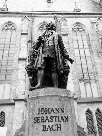 The Neues Bach Denkmal meaning new Bach monument stands since 1908 in front of the St Thomas Kirche church where Johann Sebastian Bach is buried in Leipzig Germany in black and whiteのeditorial素材