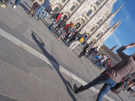 MILAN, ITALY - MARCH 28, 2015: Tourists in the Piazza Duomo square in front of Milan Cathedral churchのeditorial素材