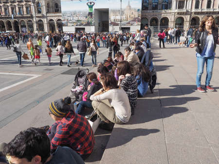 MILAN, ITALY - MARCH 28, 2015: Tourists in the Piazza Duomo square in front of Milan Cathedral...