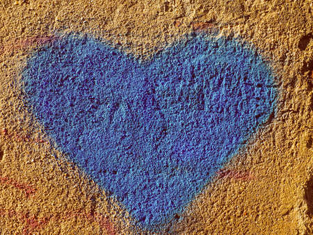 Vintage looking Heart as a sign of love and painted on a wallの写真素材