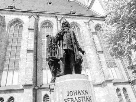 The Neues Bach Denkmal meaning new Bach monument stands since 1908 in front of the St Thomas Kirche church where Johann Sebastian Bach is buried in Leipzig Germany in black and whiteのeditorial素材