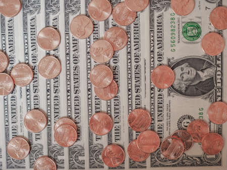 One cent coins and One Dollar banknotes  currency of the United States useful as a backgroundの写真素材