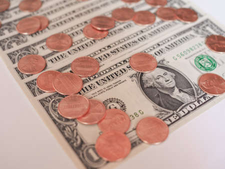 One cent coins and One Dollar banknotes  currency of the United States useful as a backgroundの写真素材