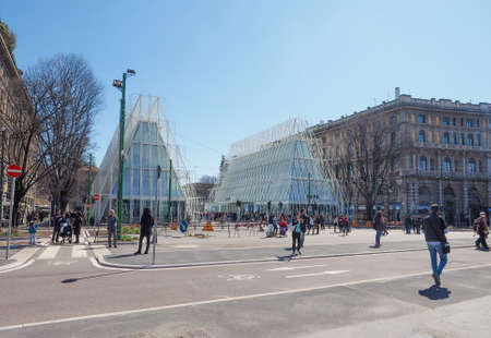 MILAN, ITALY - MARCH 28, 2015: Tourists in front of the Expo Gate information centre in Milan as...
