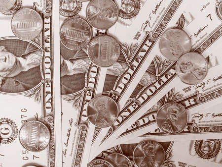 Vintage looking One cent coins and One Dollar banknotes  currency of the United States useful as a...