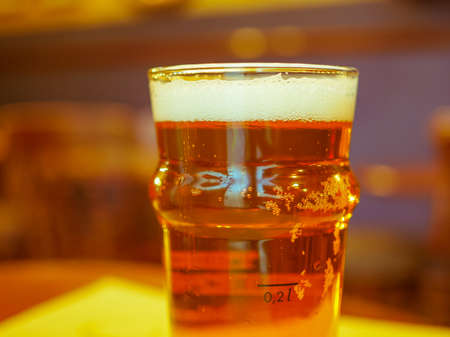 A pint of British ale beer alcoholic drink in a pub