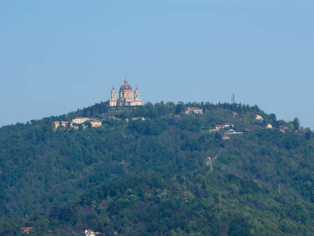 View of the hills surrounding the city of Turin, Italy with the Basilica di Superga baroque church on top of the hillの写真素材