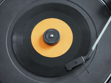 Vinyl record on a turntable record player, single 45rpm discの写真素材