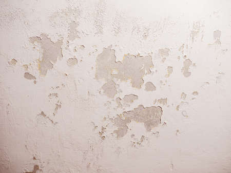 Vintage looking Damage caused by damp and moisture on a wallの写真素材