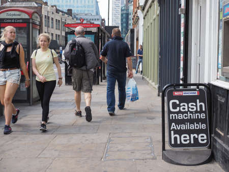 LONDON, UK - JUNE 12, 2015: People in busy Shoreditch High Street in the Liverpool Station areaのeditorial素材