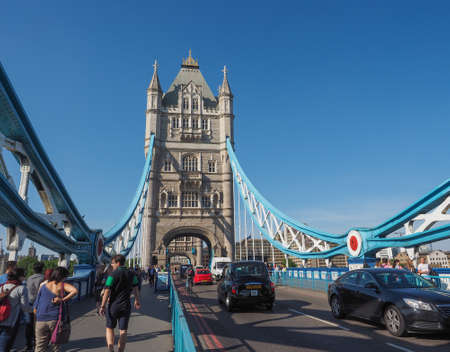 LONDON, UK - JUNE 11, 2015: Tourists visiting Tower Bridge on River Thamesのeditorial素材