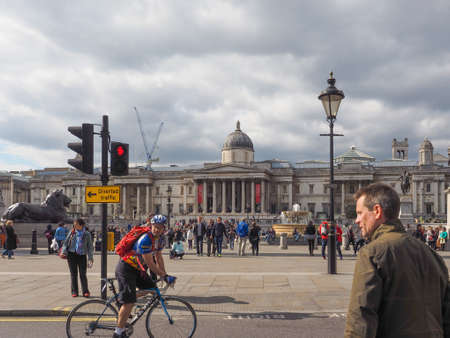 LONDON, UK - JUNE 09, 2015: Tourists visiting Trafalgar Square in front of the National Galleryのeditorial素材