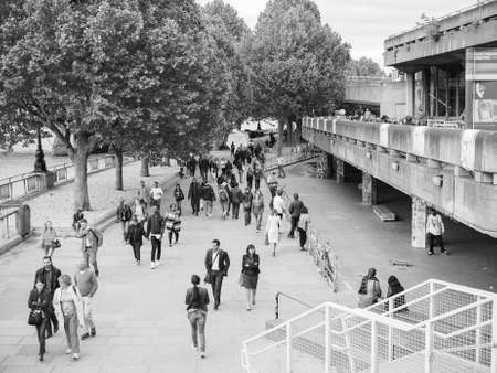 LONDON, UK - JUNE 09, 2015: People walking on the South Bank of Thames River in black and whiteのeditorial素材