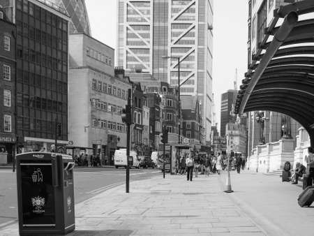 LONDON, UK - JUNE 12, 2015: People in busy Shoreditch High Street in the Liverpool Station area in black and whiteのeditorial素材