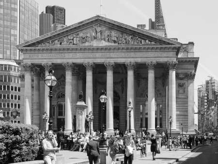 LONDON, UK - JUNE 11, 2015: People in front of The Royal Stock Exchange in black and white