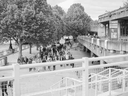 LONDON, UK - JUNE 09, 2015: People walking on the South Bank of Thames River in black and whiteのeditorial素材
