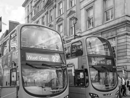 LONDON, UK - JUNE 09, 2015: Red double decker buses are a traditional landmark of London in black and whiteのeditorial素材