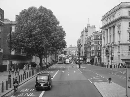 LONDON, UK - JUNE 12, 2015: Tourists in busy central London street in black and whiteのeditorial素材