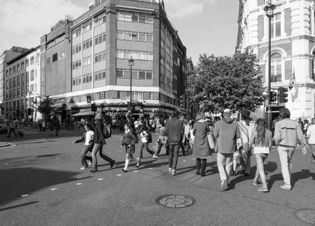 LONDON, UK - JUNE 10, 2015: Tourists in busy central London street in black and whiteのeditorial素材