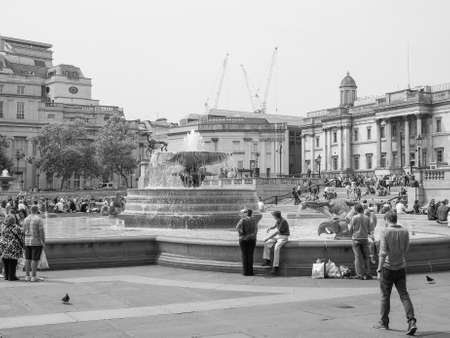 LONDON, UK - JUNE 12, 2015: Tourists visiting Trafalgar Square in front of the National Gallery in black and whiteのeditorial素材