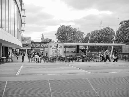 LONDON, UK - JUNE 09, 2015: People walking on the South Bank of Thames River in black and whiteのeditorial素材