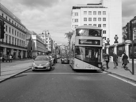 LONDON, UK - JUNE 09, 2015: Red double decker buses are a traditional landmark of London in black and whiteのeditorial素材