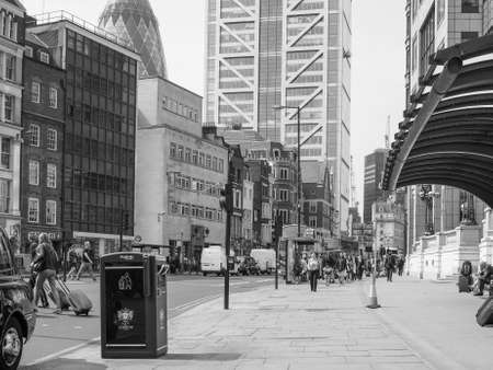 LONDON, UK - JUNE 12, 2015: People in busy Shoreditch High Street in the Liverpool Station area in black and whiteのeditorial素材