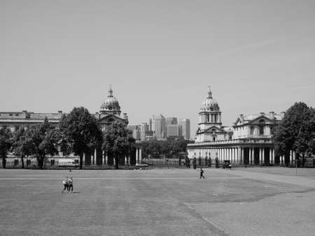 LONDON, UK - JUNE 11, 2015: The Canary Wharf business centre which is the largest business district in the United Kingdom seen from Greenwich park in black and whiteのeditorial素材