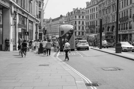 LONDON, UK - JUNE 12, 2015: Tourists in busy central London street in black and whiteのeditorial素材