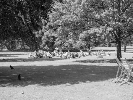 LONDON, UK - JUNE 11, 2015: People sunbathing in St James Park in the morning in black and whiteのeditorial素材
