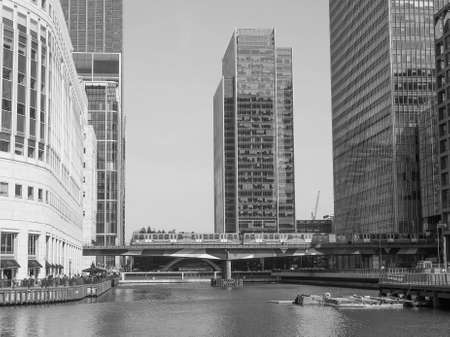 LONDON, UK - JUNE 11, 2015: The Canary Wharf business centre is the largest business district in the United Kingdom in black and whiteのeditorial素材