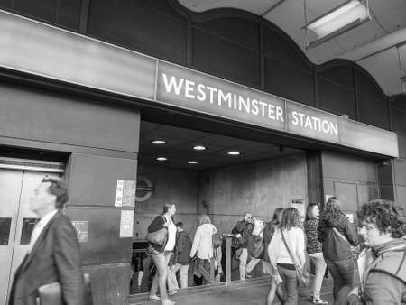 Travellers at Westminster underground station in London, UK in black and whiteのeditorial素材
