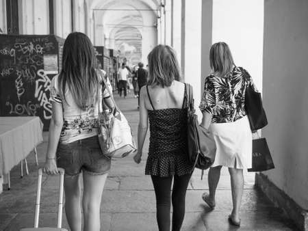 TURIN, ITALY - JUNE 19, 2015: Tourists in Via Po ancient central baroque street in black and whiteのeditorial素材