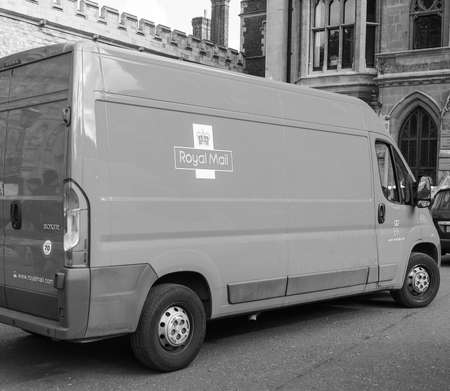 LONDON, UK - JUNE 09, 2015: Red Royal Mail van for mail delivery in central London in black and whiteのeditorial素材