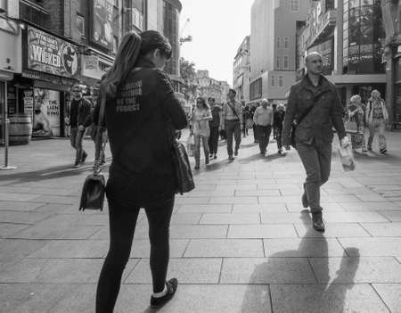 LONDON, UK - JUNE 10, 2015: Tourists in busy central London street in black and whiteのeditorial素材