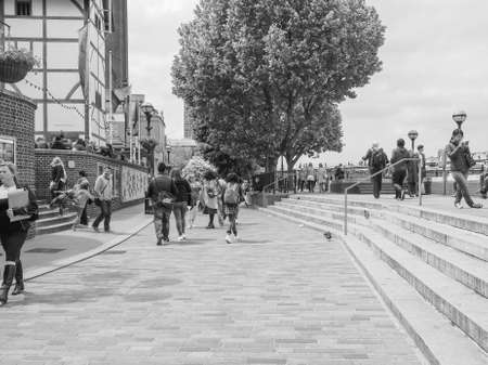 LONDON, UK - JUNE 10, 2015: People walking on the River Thames South Bank in black and whiteのeditorial素材