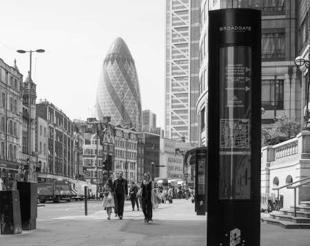 LONDON, UK - JUNE 12, 2015: People in busy Shoreditch High Street in the Liverpool Station area in black and whiteのeditorial素材