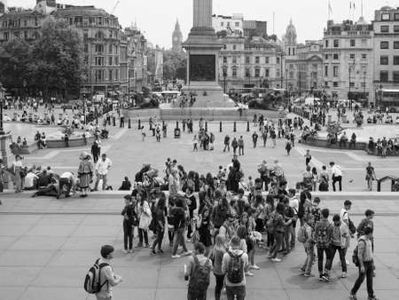 LONDON, UK - JUNE 12, 2015: Tourists visiting Trafalgar Square in black and whiteのeditorial素材