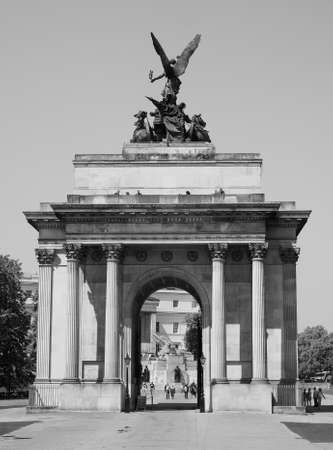 LONDON, UK - JUNE 11, 2015: Tourists visiting the Wellington arch in black and whiteのeditorial素材