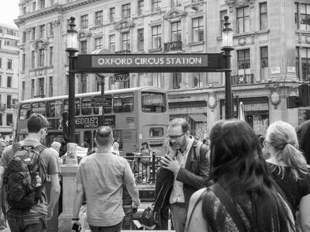 LONDON, UK - JUNE 12, 2015: Travellers at Oxford Circus underground station in black and whiteのeditorial素材