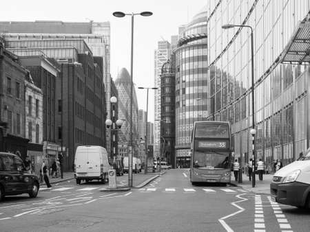 LONDON, UK - JUNE 12, 2015: People in busy Shoreditch High Street in the Liverpool Station area in black and whiteのeditorial素材