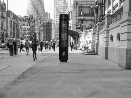 LONDON, UK - JUNE 12, 2015: People in busy Shoreditch High Street in the Liverpool Station area in black and whiteのeditorial素材