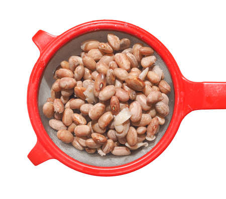 Borlotti beans vegetables in a colander isolated over white background