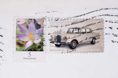 BERLIN, GERMANY - JULY 31, 2015: Stamps printed by Germany show a Krokus flower and a classic...