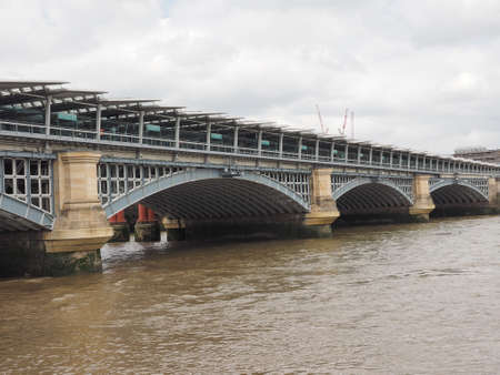 Blackfriars Bridge over River Thames in London, UKの写真素材