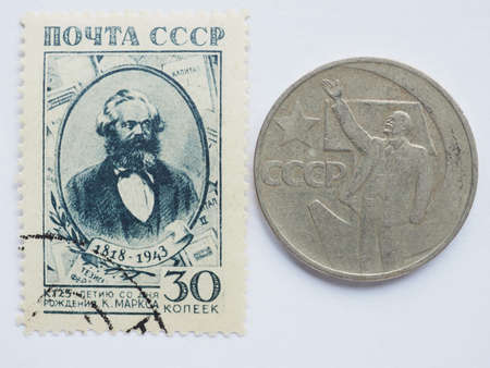 MOSCOW, RUSSIA - CIRCA 2015: A stamps printed by USSR show a Karl Marx portrait and a Ruble coin shows Leninのeditorial素材