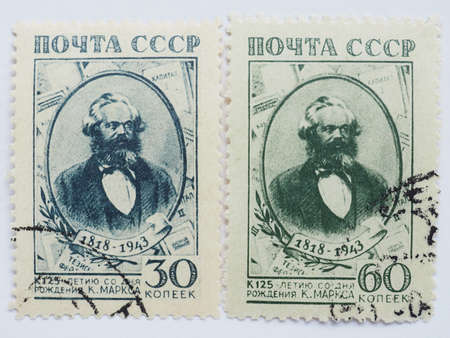 MOSCOW, RUSSIA - CIRCA 2015: Two stamps printed by USSR show a Karl Marx portraitのeditorial素材